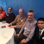 Group of Auggie alums at table